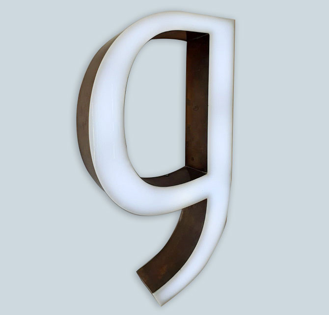 Built-up Rimless Illuminated Acrylic Letter with Brass Side Returns